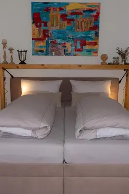 Ein Bett oder Betten in einem Zimmer der Unterkunft Ferienwohnung am Kurpark Ostrau
