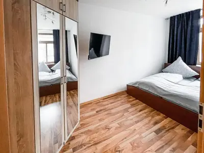 Ein Bett oder Betten in einem Zimmer der Unterkunft Zentrum, 4Personen, privater Parkplatz, WiFi, modern, ruhig