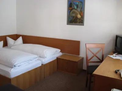 Ein Bett oder Betten in einem Zimmer der Unterkunft Dresdner Höhe