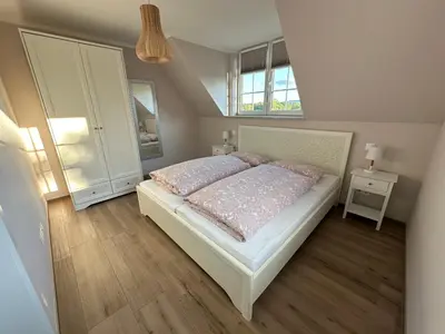 Ein Bett oder Betten in einem Zimmer der Unterkunft Ferienwohnung Oberförstchen