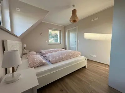 Ein Bett oder Betten in einem Zimmer der Unterkunft Ferienwohnung Oberförstchen