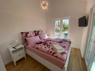 Ein Bett oder Betten in einem Zimmer der Unterkunft Ferienhaus „Am Sandstein“