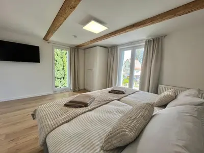 Ein Bett oder Betten in einem Zimmer der Unterkunft Ferienhaus „Am Sandstein“