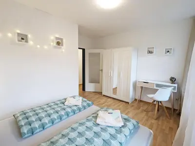 Ein Bett oder Betten in einem Zimmer der Unterkunft HW1 - Urlaubsmagie - Gemütliche Wohnung mit Saunazugang zum Entspannen
