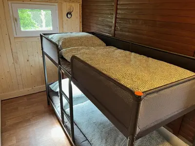 Ein Bett oder Betten in einem Zimmer der Unterkunft Berghütte Gohrisch (Sächsische Schweiz)