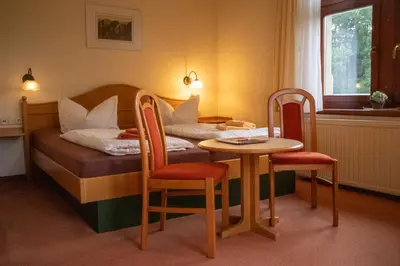 Ein Bett oder Betten in einem Zimmer der Unterkunft Sandsteinidyll