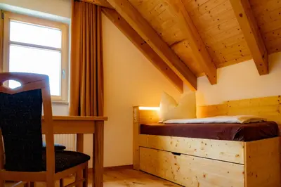 Ein Bett oder Betten in einem Zimmer der Unterkunft Sandsteinidyll