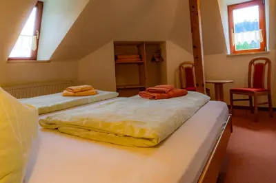 Ein Bett oder Betten in einem Zimmer der Unterkunft Sandsteinidyll