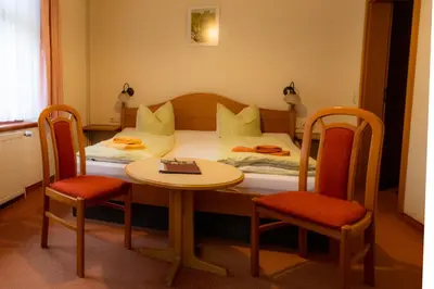 Ein Bett oder Betten in einem Zimmer der Unterkunft Sandsteinidyll