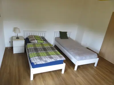 Ein Bett oder Betten in einem Zimmer der Unterkunft Haus am Park Nahe Eilenburg Wurzen
