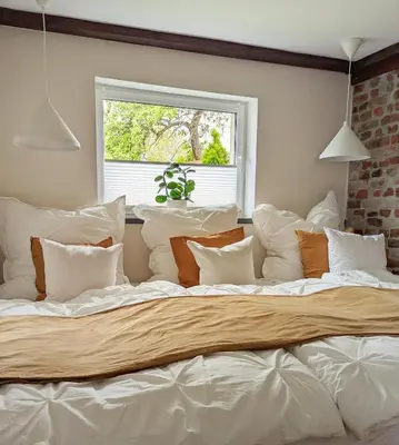 Ein Bett oder Betten in einem Zimmer der Unterkunft Ferienhaus Lausitz