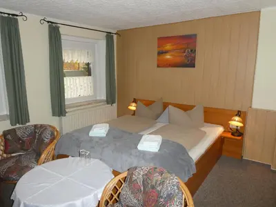 Ein Bett oder Betten in einem Zimmer der Unterkunft Gaststätte & Pension Oelmuehle