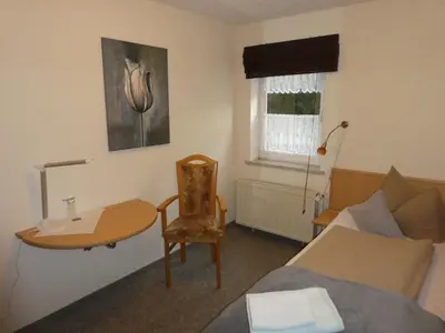 Ein Sitzbereich in der Unterkunft Gaststätte & Pension Oelmuehle