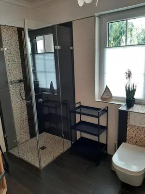 Ein Badezimmer in der Unterkunft Seeliebe mit Sauna und nur 50 mtr. bis zum Strand
