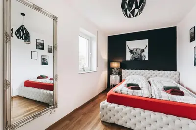 Ein Bett oder Betten in einem Zimmer der Unterkunft Moderne FeWo in ruhiger Lage