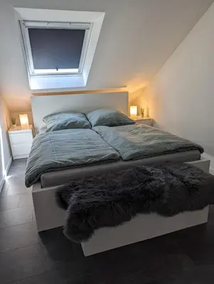Ein Bett oder Betten in einem Zimmer der Unterkunft Ferienwohnung Am Stadtpark
