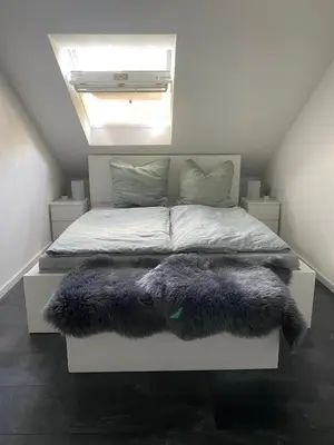 Ein Bett oder Betten in einem Zimmer der Unterkunft Ferienwohnung Am Stadtpark
