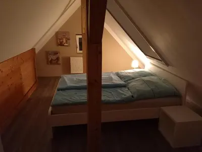 Ein Bett oder Betten in einem Zimmer der Unterkunft FeWo Zum Malerweg Pirna