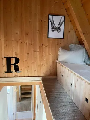 Ein Bett oder Betten in einem Zimmer der Unterkunft Kleines Chalet im Erzgebirge mit Sauna und Kamin