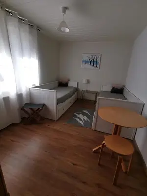 Ein Bett oder Betten in einem Zimmer der Unterkunft Gartenwohnung Paulsdorf