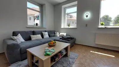 Ein Sitzbereich in der Unterkunft Ferienwohnung am Hofladen Hellendorf - Sächsische Schweiz