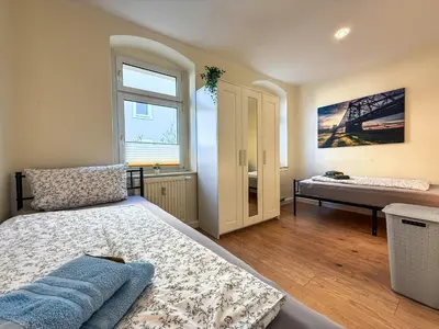 Ein Bett oder Betten in einem Zimmer der Unterkunft MonteurWohnung Sporbitzer Stübchen