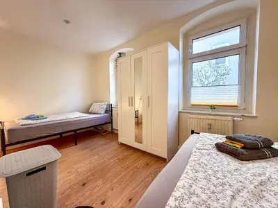 Ein Bett oder Betten in einem Zimmer der Unterkunft MonteurWohnung Sporbitzer Stübchen