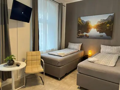 Ein Bett oder Betten in einem Zimmer der Unterkunft Pension Kaditz