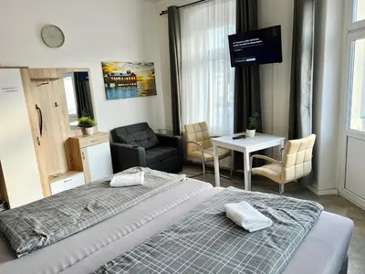 Ein Bett oder Betten in einem Zimmer der Unterkunft Pension Kaditz