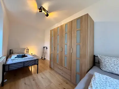 Ein Bett oder Betten in einem Zimmer der Unterkunft Wohnperle Sporbitzer Stübchen 2