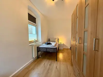 Ein Bett oder Betten in einem Zimmer der Unterkunft Wohnperle Sporbitzer Stübchen 2