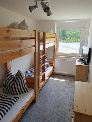 Ein Bett oder Betten in einem Zimmer der Unterkunft Ferienwohnung Wandersruh - Oase der Ruhe am Malerweg und die sächs. Schweiz direkt vor der Haustür
