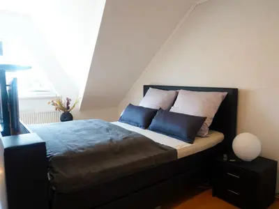 Ein Bett oder Betten in einem Zimmer der Unterkunft Astrids Seehaus