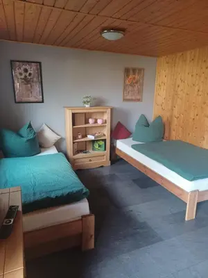 Ein Bett oder Betten in einem Zimmer der Unterkunft Waldblick