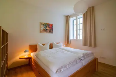 Ein Bett oder Betten in einem Zimmer der Unterkunft Atelier 29: Ferienwohnung am Fuße des Valtenberges