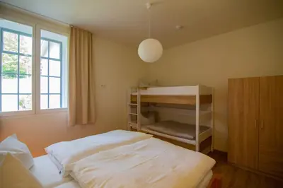 Ein Bett oder Betten in einem Zimmer der Unterkunft Atelier 29: Ferienwohnung am Fuße des Valtenberges