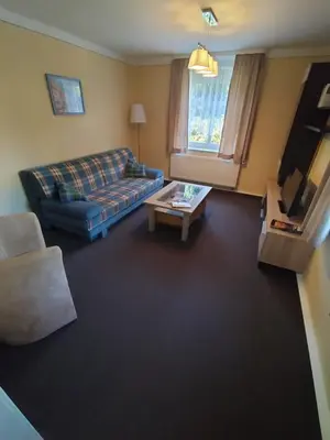 Ein Sitzbereich in der Unterkunft Ferienwohnung 3 Am Zahnsborn