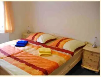 Ein Bett oder Betten in einem Zimmer der Unterkunft Ferienwohnung 1 Am Zahnsborn