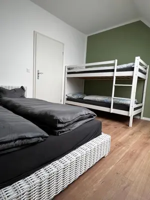 Ein Bett oder Betten in einem Zimmer der Unterkunft Ferienwohnung zum Scheibe-See