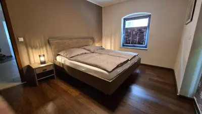 Ein Bett oder Betten in einem Zimmer der Unterkunft Ferienwohnung Kraxlhütte Dresden