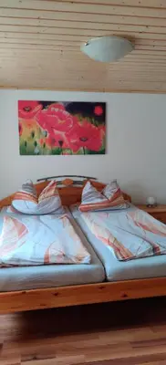 Ein Bett oder Betten in einem Zimmer der Unterkunft Urlaub auf dem Reiterhof Schaarschmidt