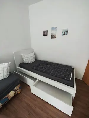 Ein Bett oder Betten in einem Zimmer der Unterkunft Ferienwohnung Monteurswohnung Großräschen