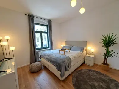 Ein Bett oder Betten in einem Zimmer der Unterkunft Gemütliche helle Ferienwohnung