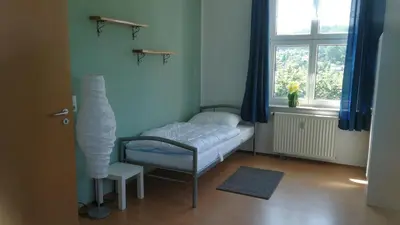 Ein Bett oder Betten in einem Zimmer der Unterkunft Ferienwohnung Sonnenblick