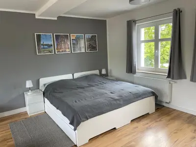 Ein Bett oder Betten in einem Zimmer der Unterkunft Ferienwohnung-Elbland