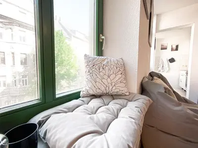 Ein Sitzbereich in der Unterkunft Zentrales Apartment mit TV, Küche und Mikrowelle