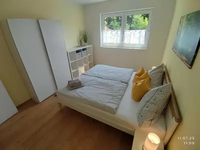 Ein Bett oder Betten in einem Zimmer der Unterkunft Ferienapartment 21