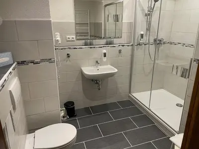 Ein Badezimmer in der Unterkunft Gasthof Hertigswalde