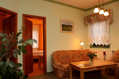 Ein Sitzbereich in der Unterkunft Gasthof Hertigswalde