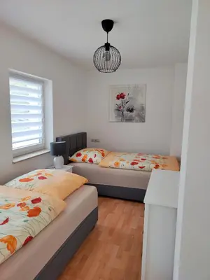 Ein Bett oder Betten in einem Zimmer der Unterkunft Ferienwohnung zur alten Post